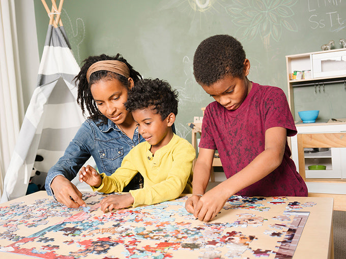 family playing a puzzle together