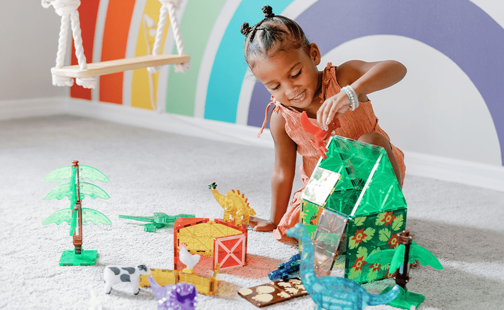girl playing with magna tiles